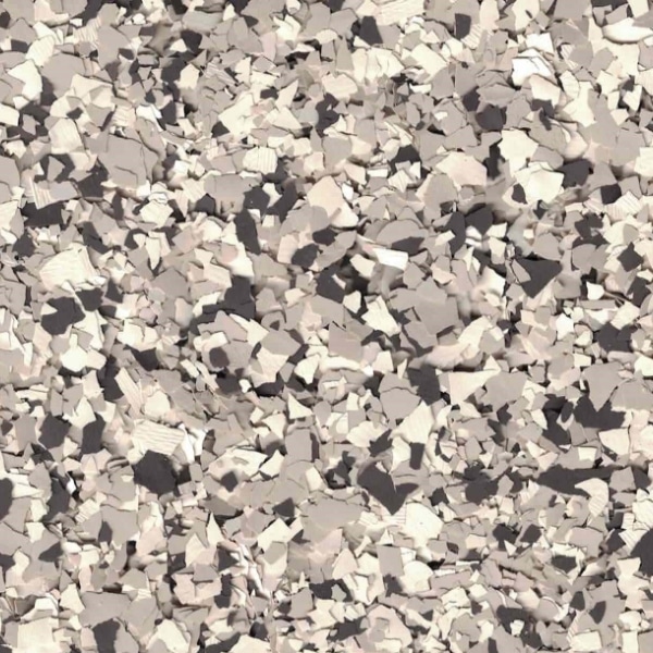 A textured, close-up view of beige and gray random geometric shapes, creating an abstract pattern resembling scattered paper fragments.