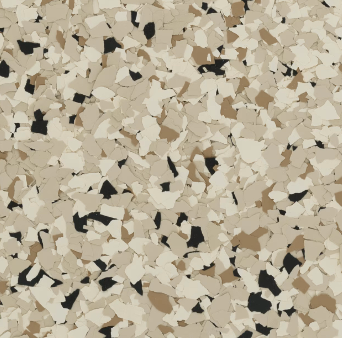 A textured surface composed of beige, white, and black irregular chips. The abstract pattern appears like decorative flooring material, no landmarks visible.