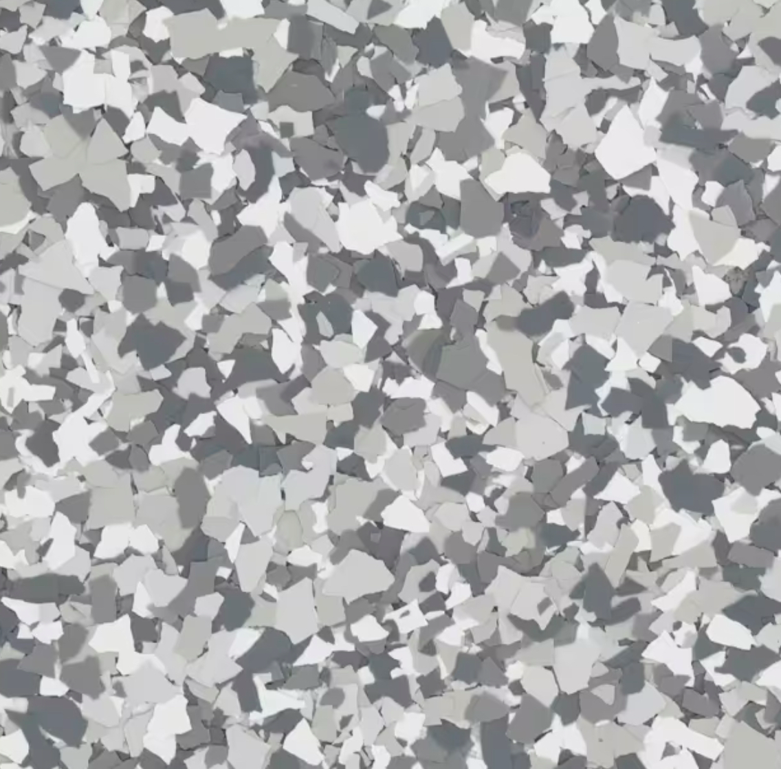A close-up view of a gray and white speckled surface, possibly terrazzo flooring, with various irregularly shaped fragments interspersed.